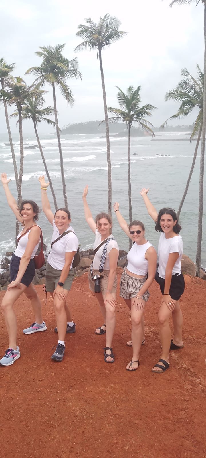 Friends posing on Coconut Tree Hill in Mirissa