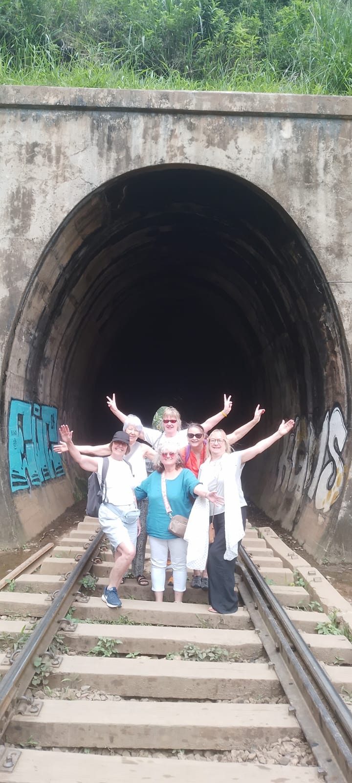 Group of friends at a railway tunnel near Ella