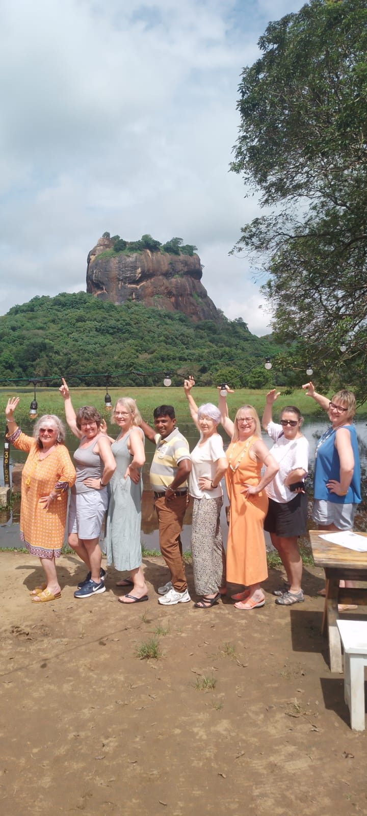 Group of travellers in front of Sigiriya Rock